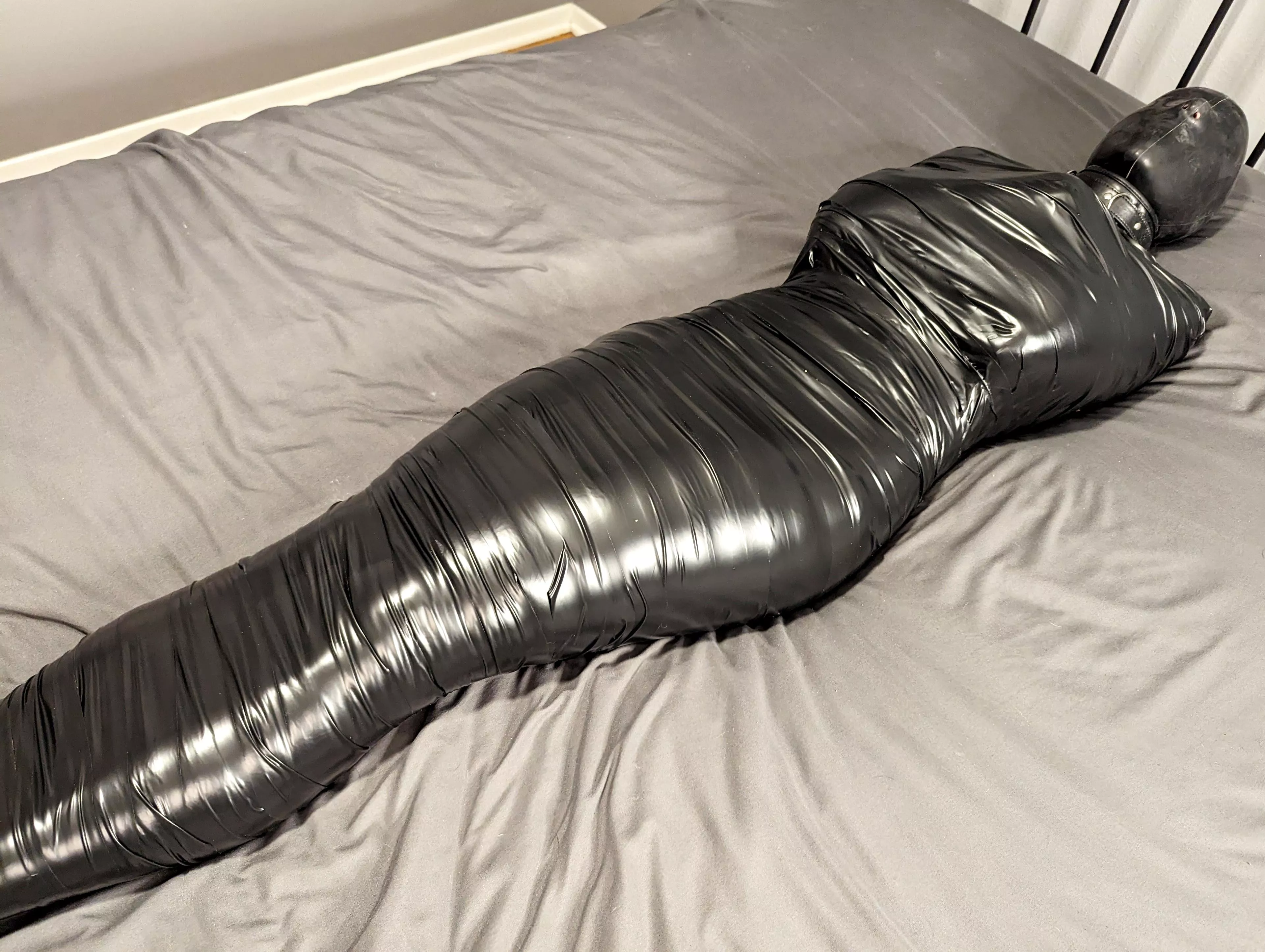 Would you cut me free? Or would you play with the remote control vibrator sealed inside me with layers of tape?