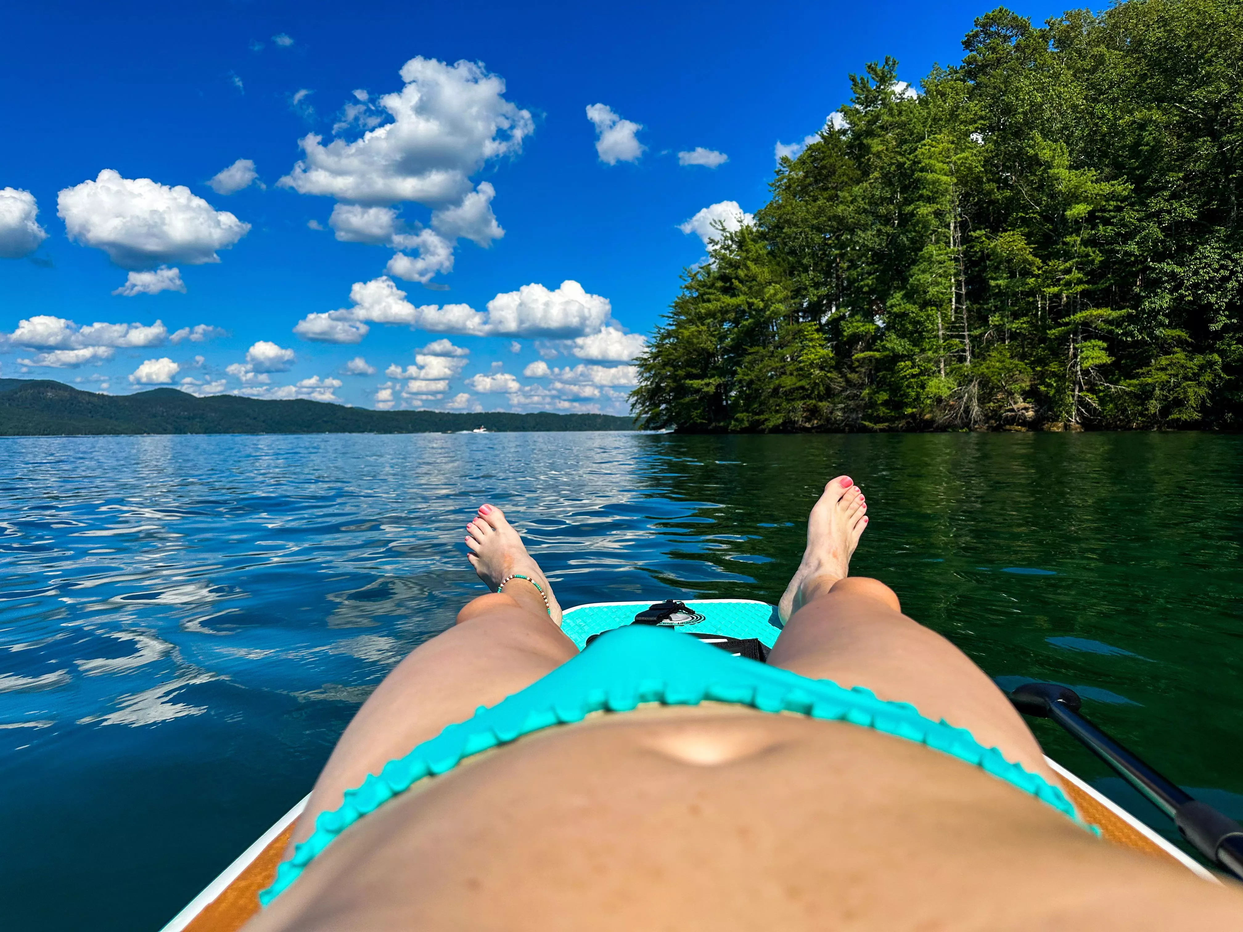 Enjoying the afternoon in my ruffled bikini on the lake.