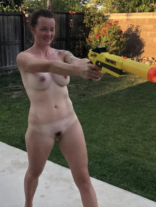 Hot summer days mean naked Nerf fights in the back yard.