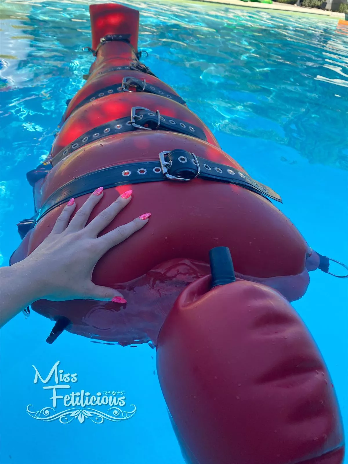 Floating in heavy rubber bondage sack