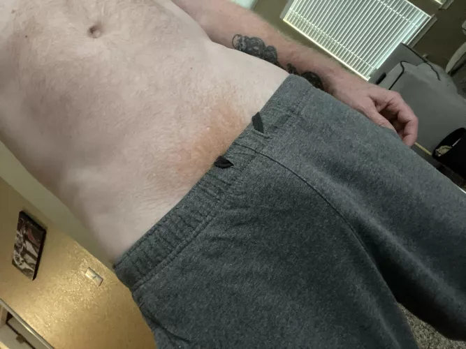 Grey sweatpants and ginger bush are a perfect combo