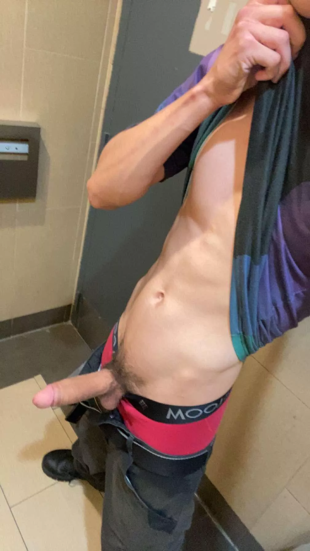 Young father hiding at work