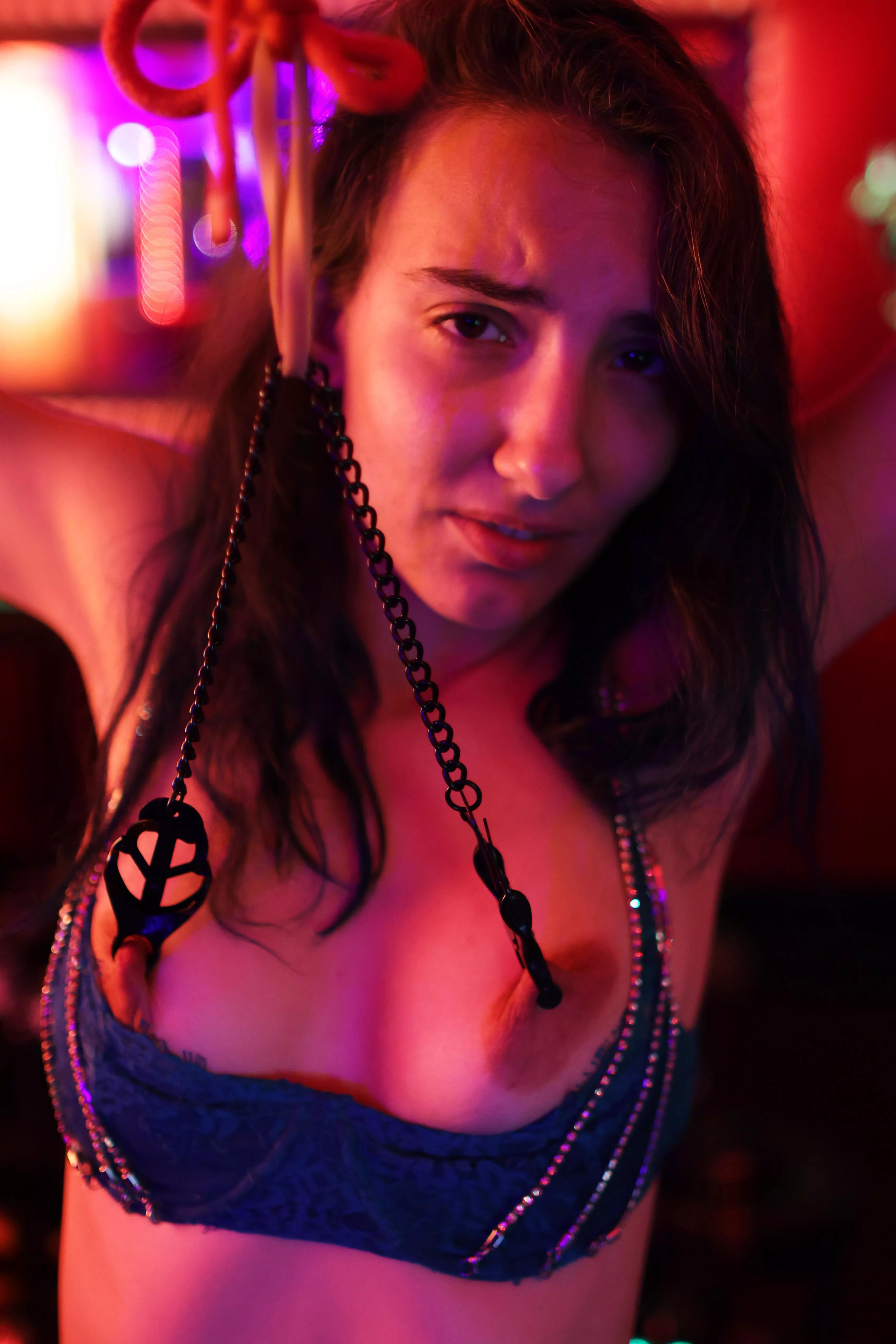 ForestBorn with nipple clamps tied above her