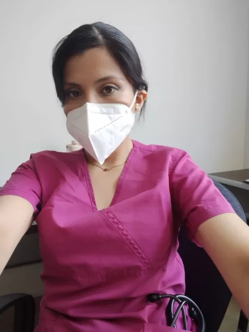 Pretty eyes face and sexy body in purple scrub