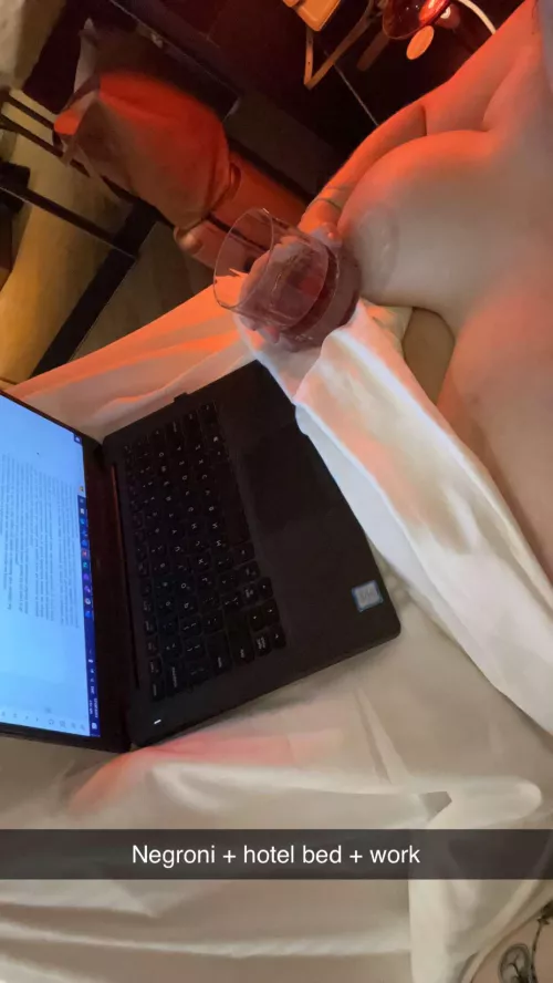Negroni + hotel bed + work