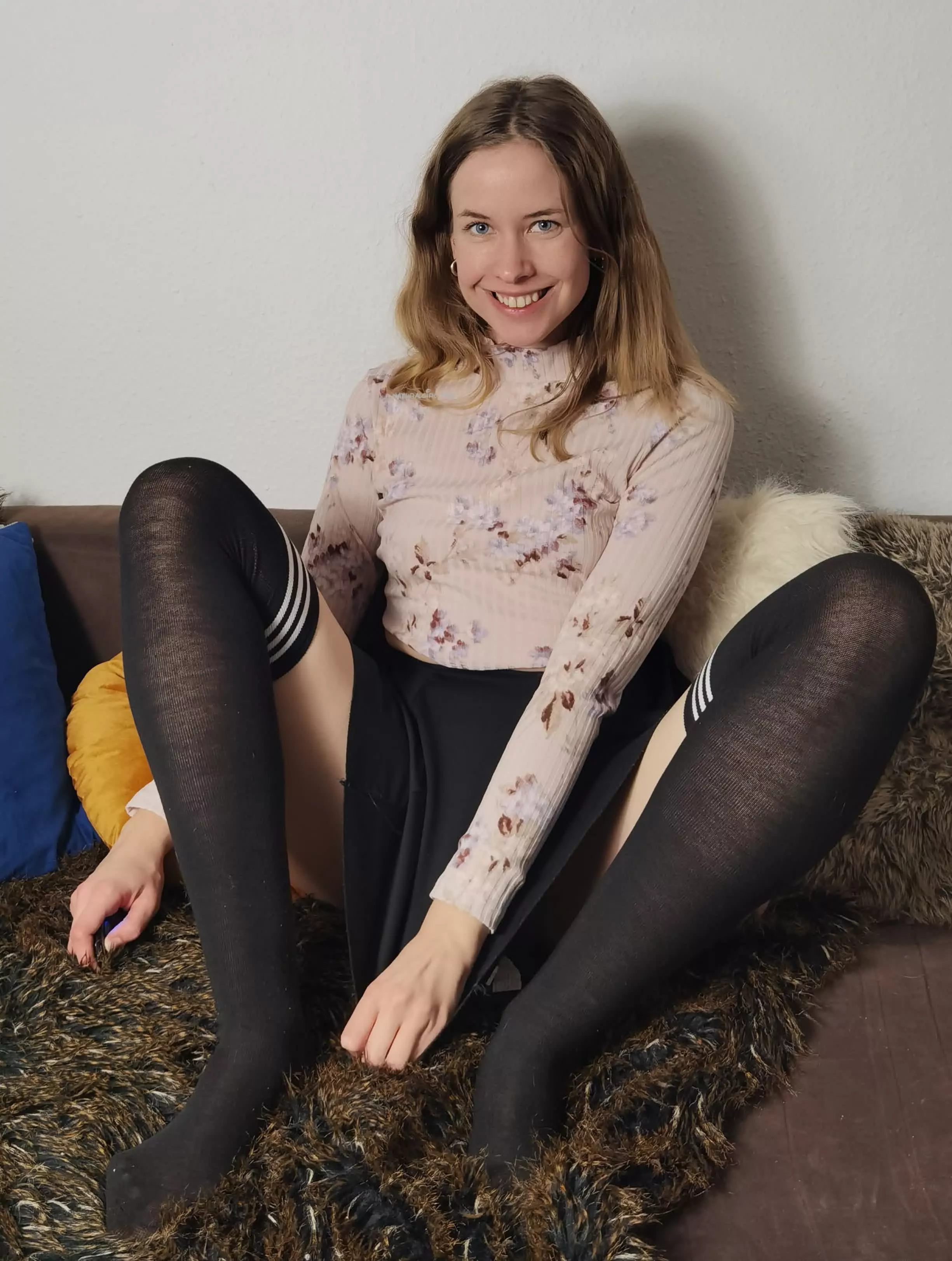Black skirt, black kneesocks and a smile