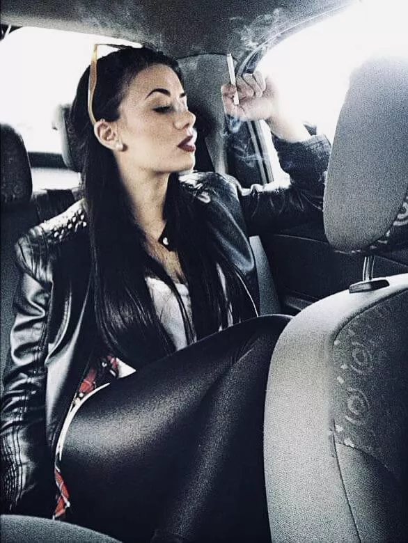 Filling the car with her smoke