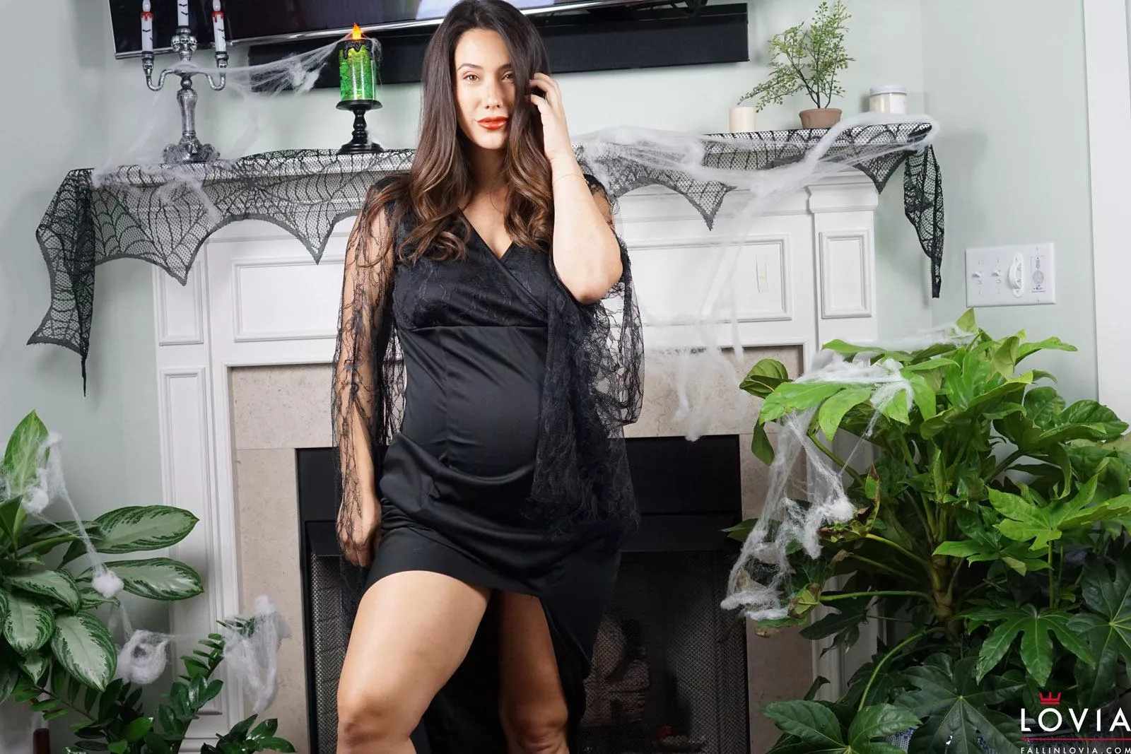 Pregnant Eva Lovia in black dress