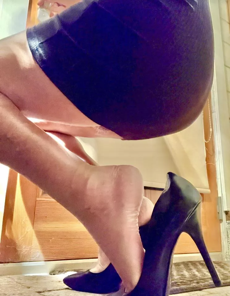 Black pumps and a short skirt