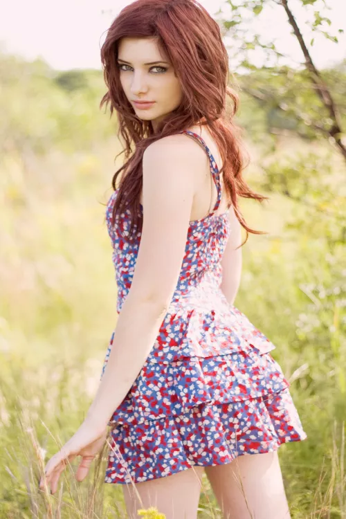 Susan Coffey in short print dress