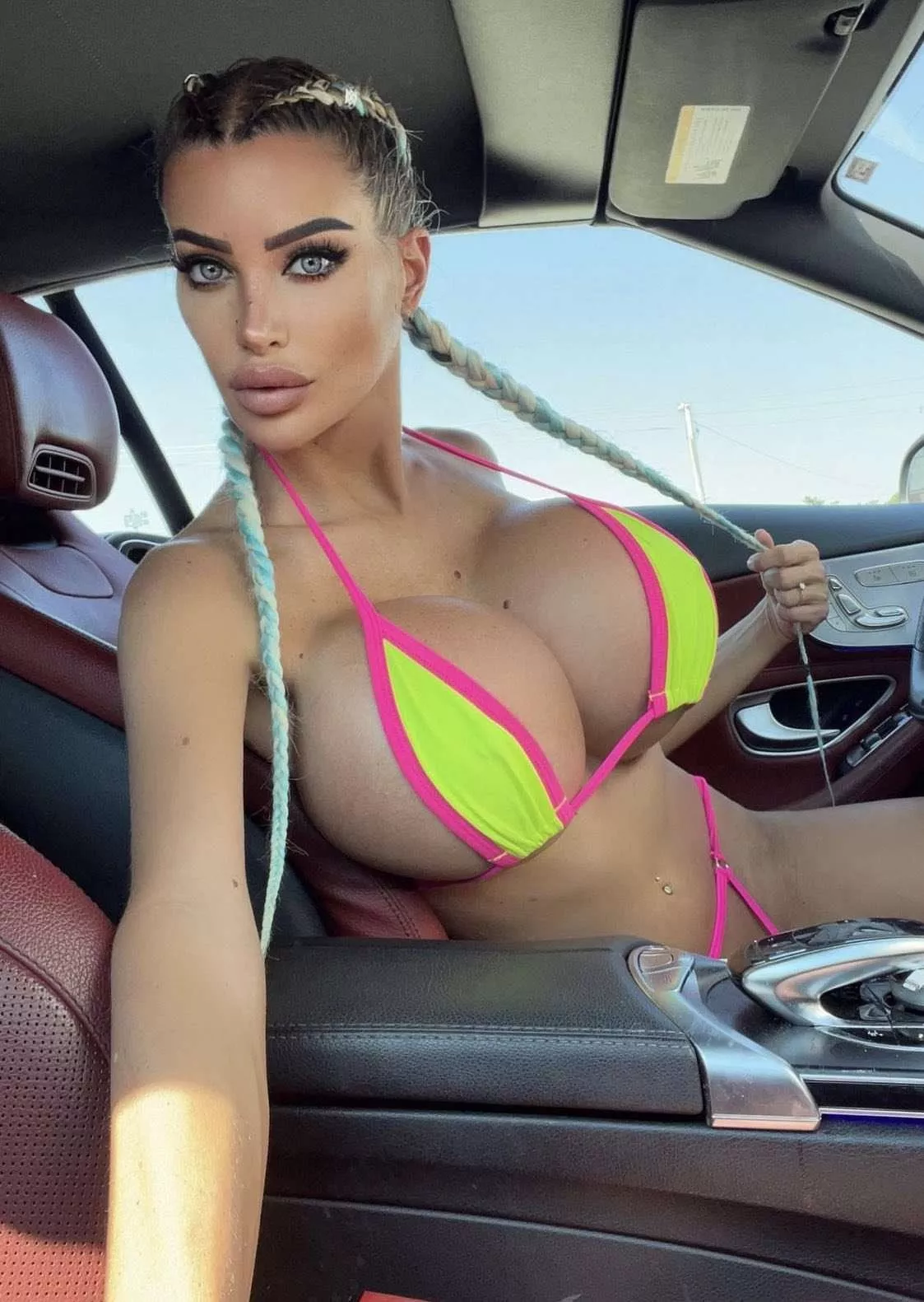 Driving in her bikini