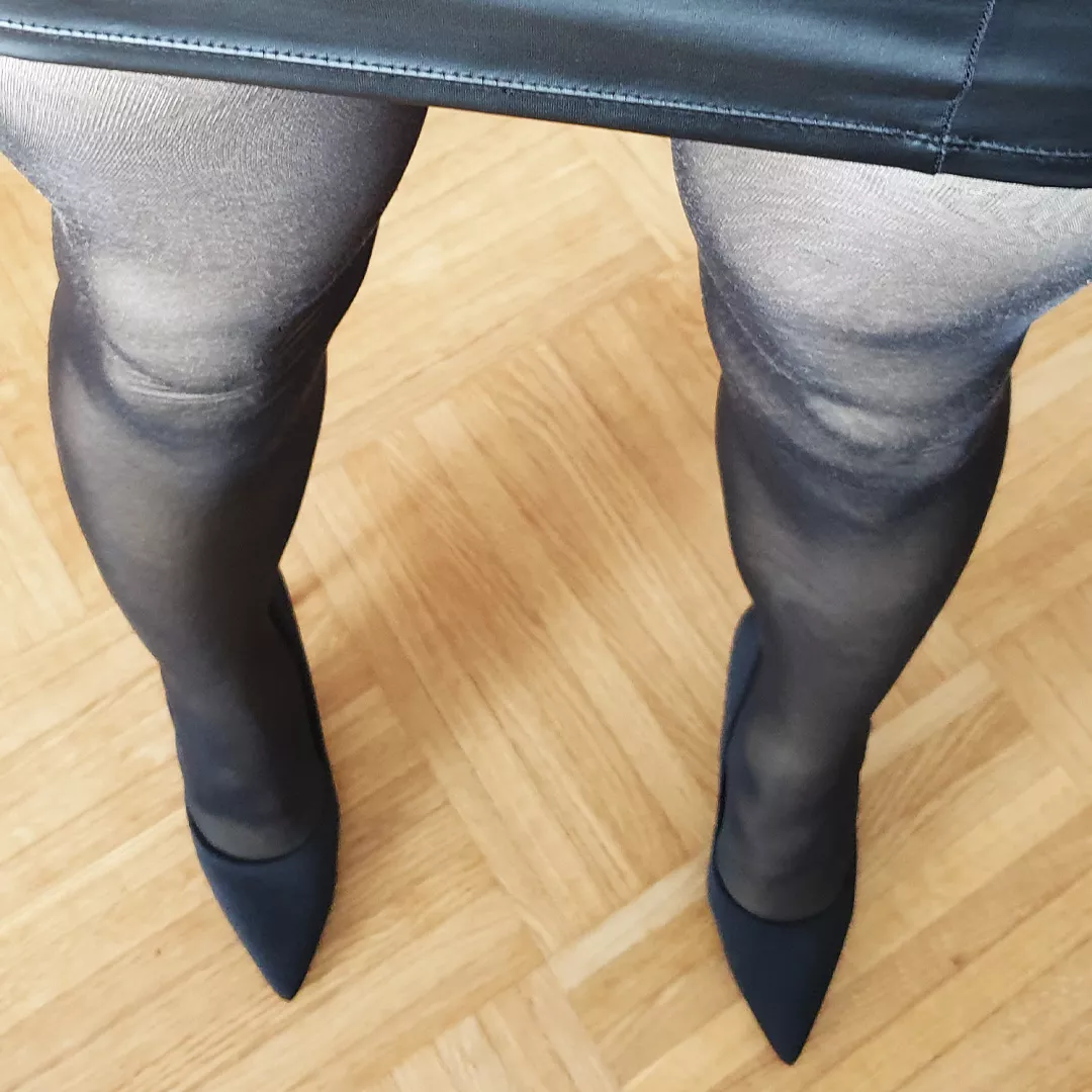 Leather mini skirt & pointy black heels (& wood floor!)