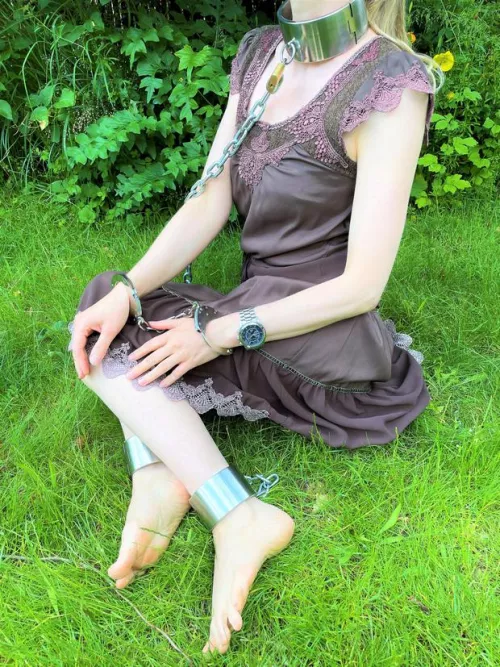 I'm locked in full steel restraints outdoors