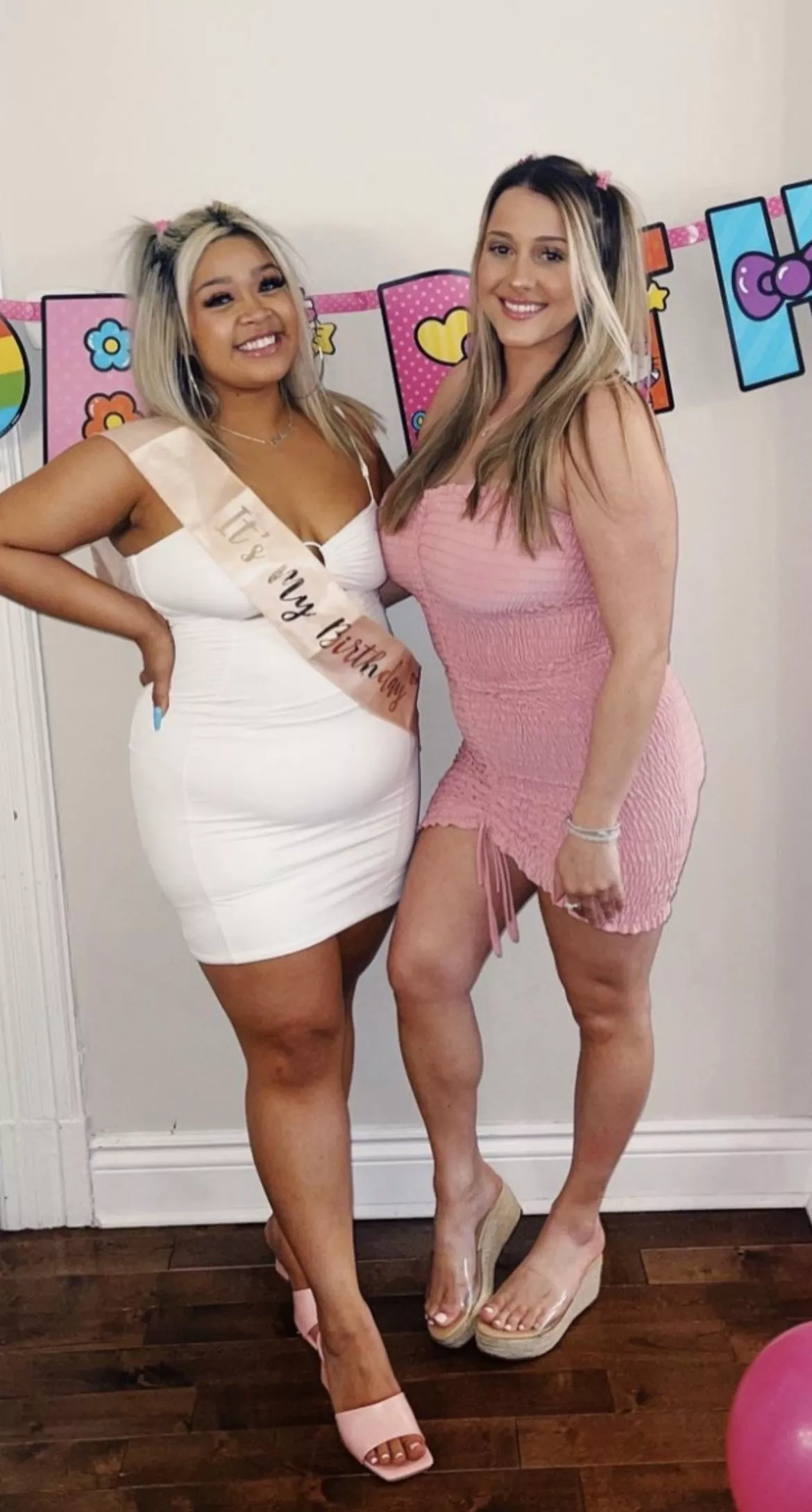 Is the girl on the right intentionally sticking her chest out ?