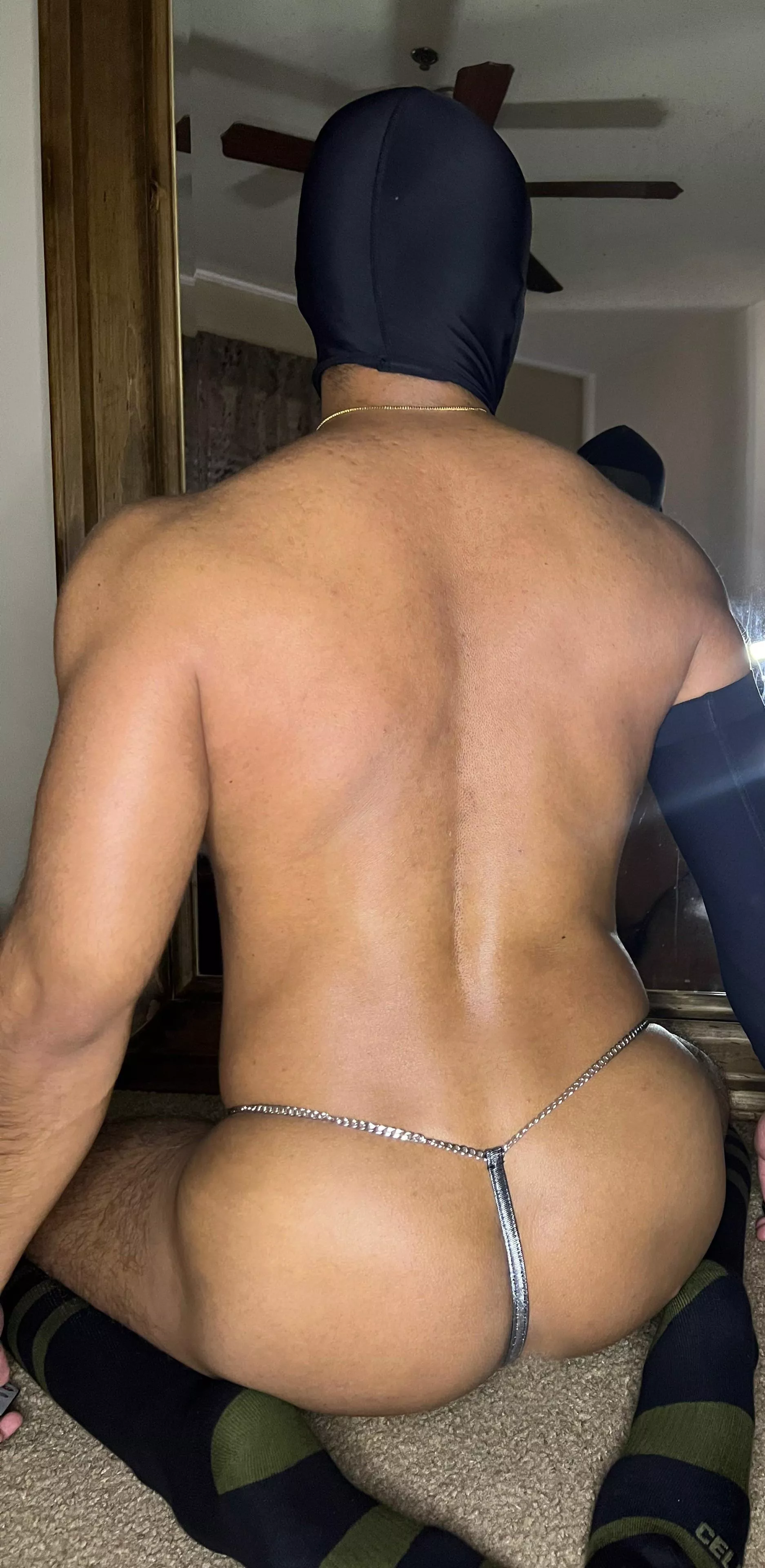 Showing off metallic thong