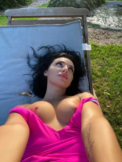 Sunbathing and imagining you playing with my tits while I rest.