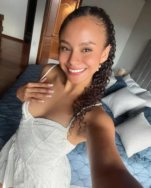 All white and a big smile