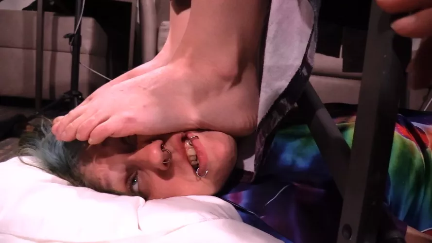 Face crushed under massive soles for her comfort