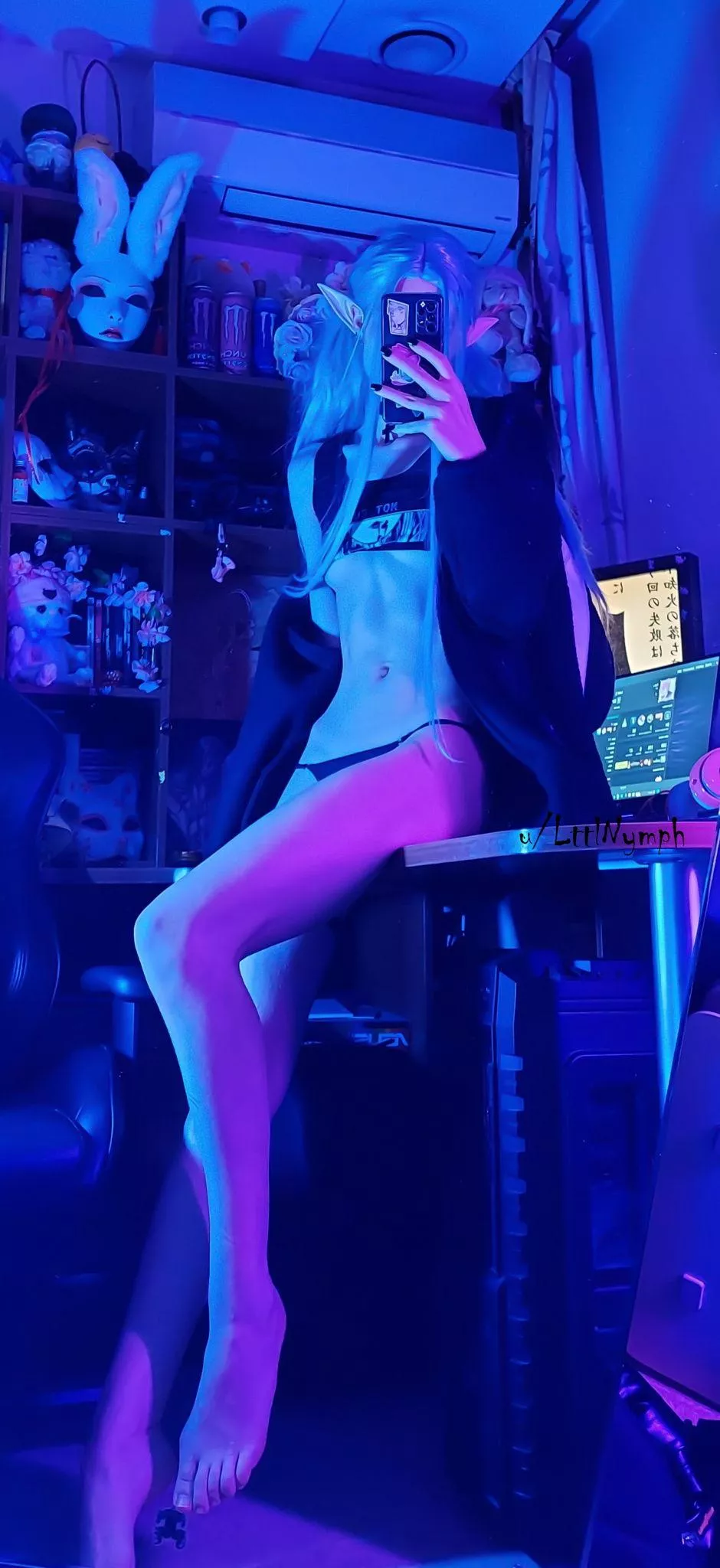 A cluttered corner and me sitting on the table for no reason