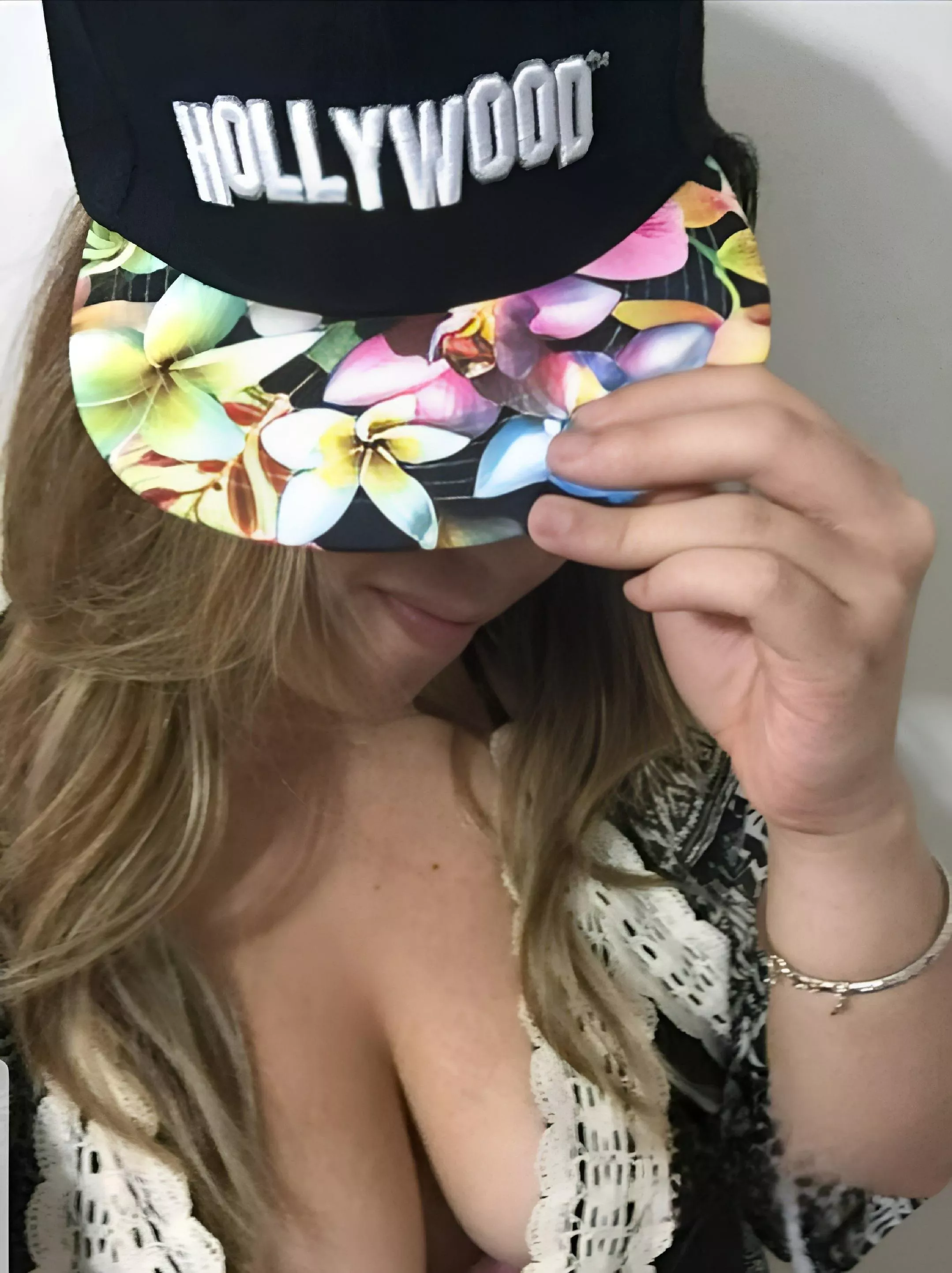 Like my hat or my low cut more?