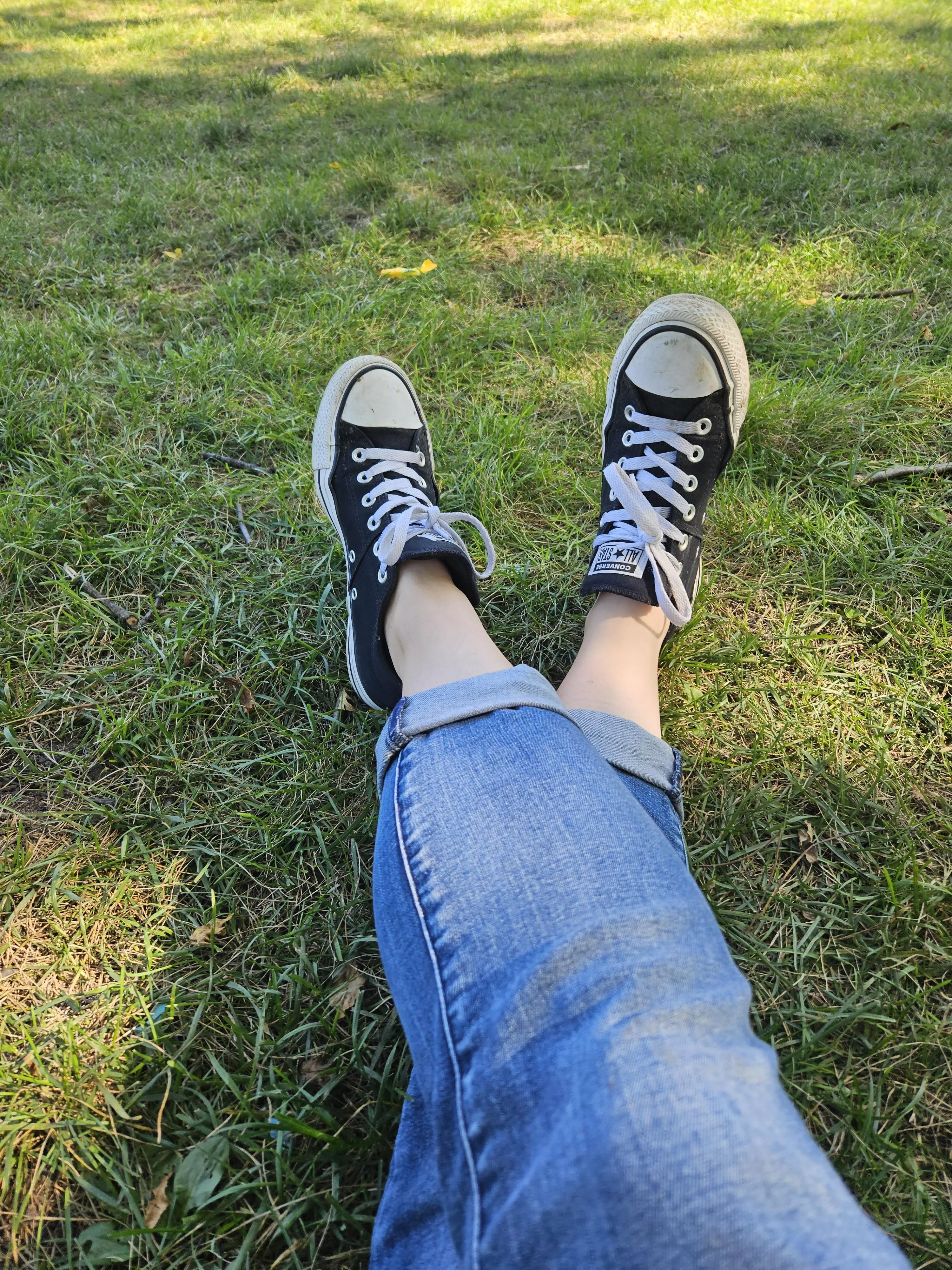Beautiful day for wearing Converse in the park