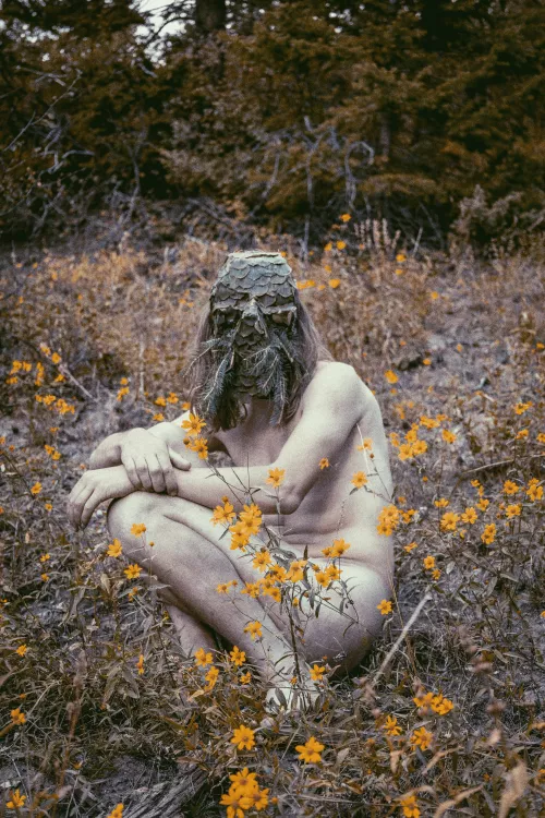 Among the fall flowers.