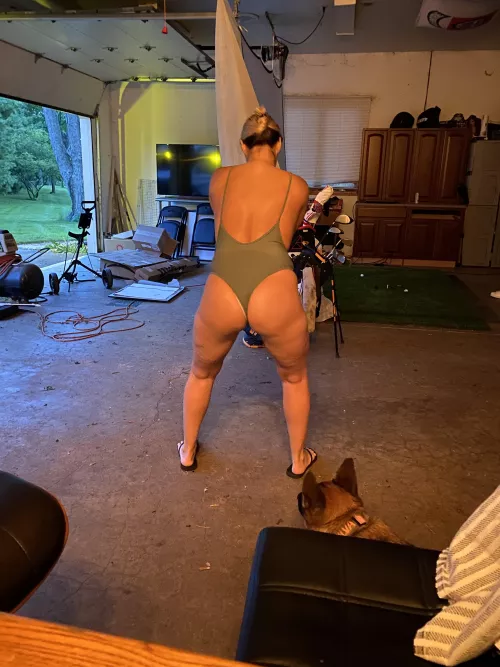 Practicing her golf swing