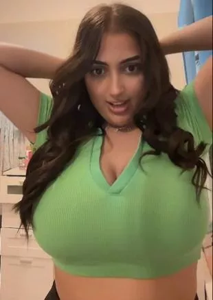 Her top holds it barely