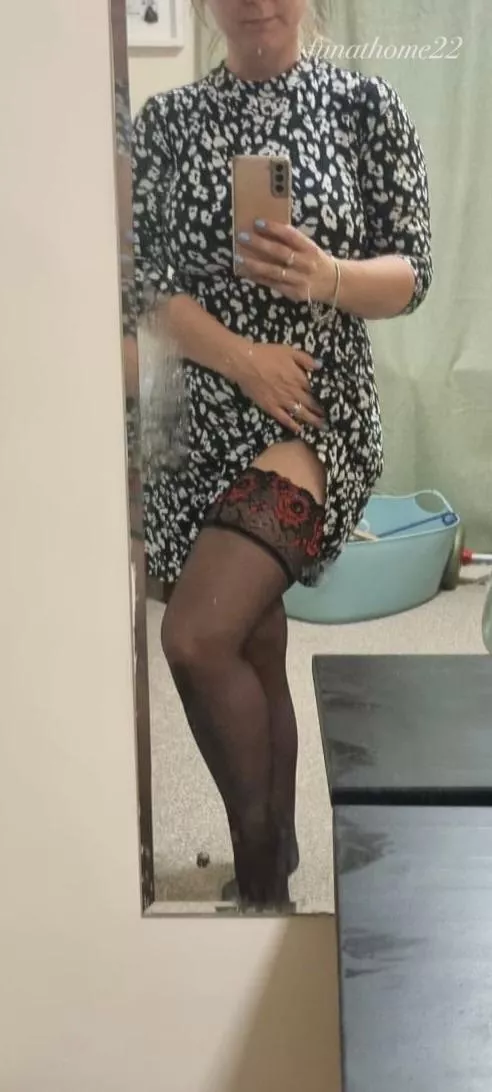 Dress is just short enough that the stocking tops don’t stay hidden