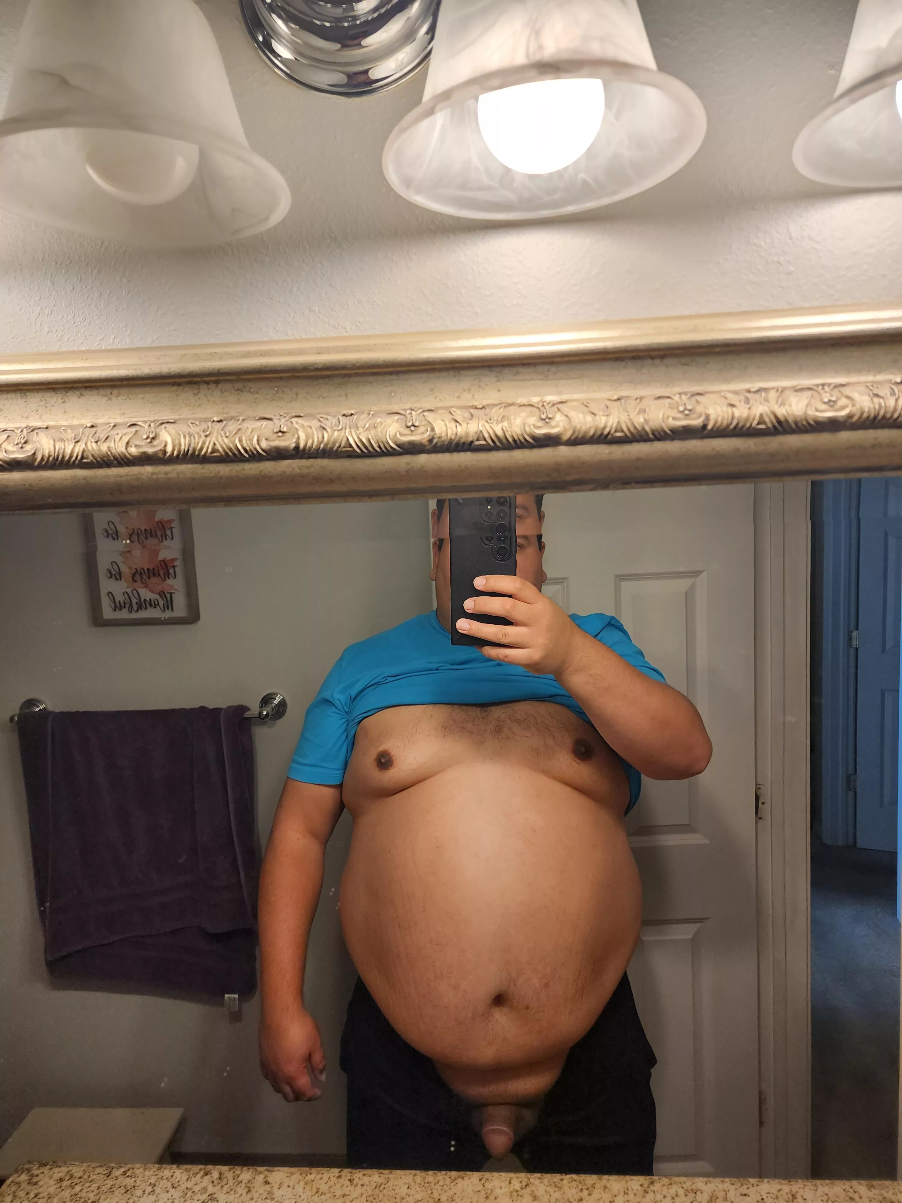 Just a fat guy with his cock out.