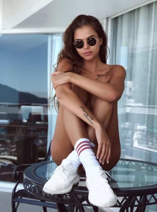 Viki with glasses and sneakers