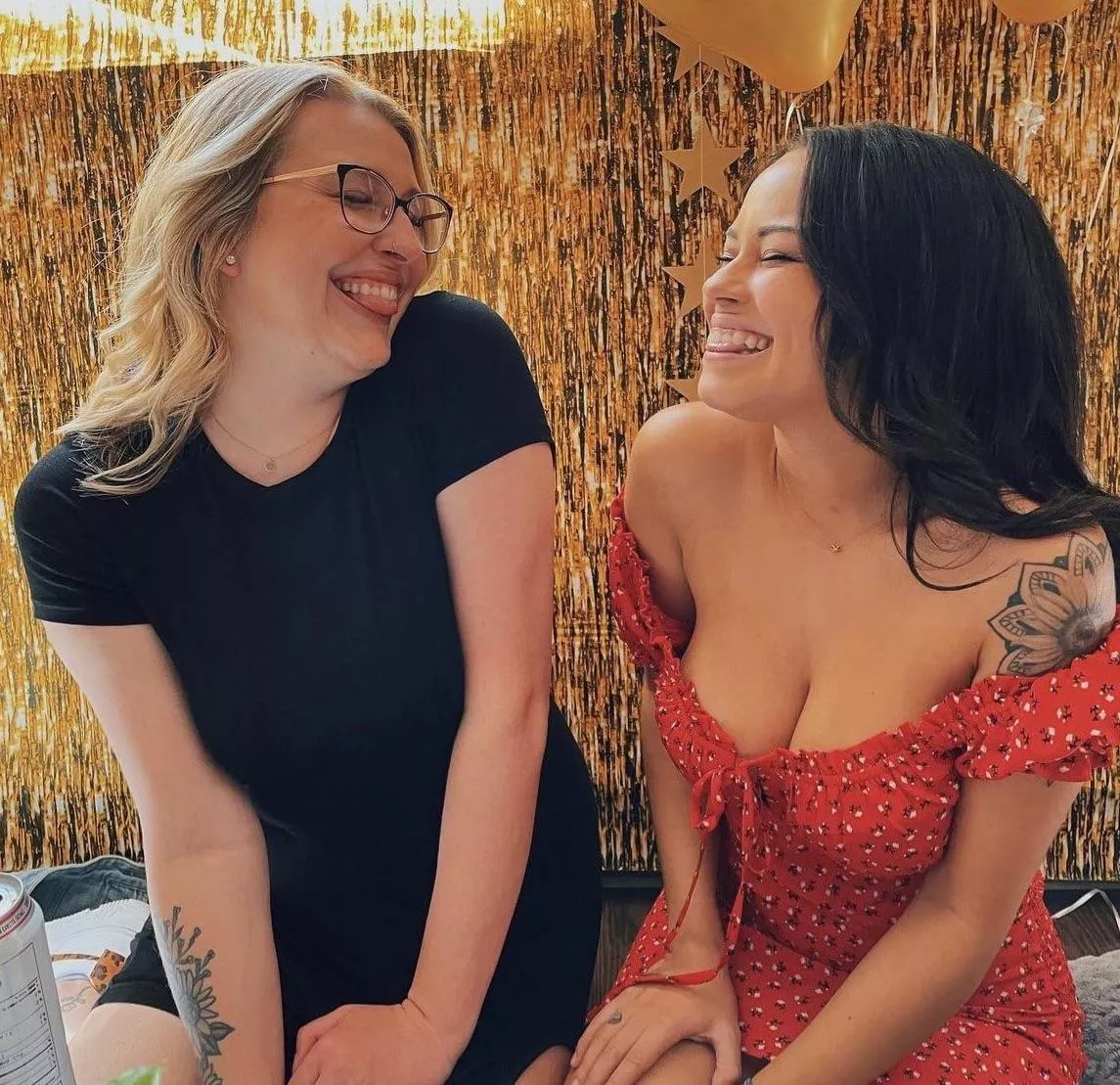 Do you think the girl on the right knows her top is falling down ?