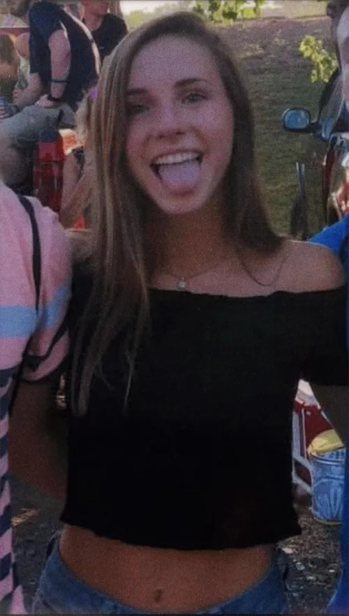 Showing off her belly button