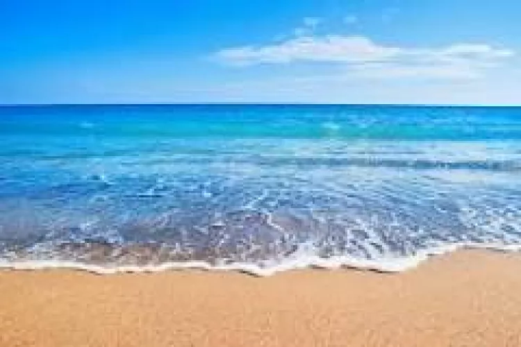 A beach is a narrow, gently sloping strip of land that lies along the edge of an ocean, lake, or river. Materials such as sand, pebbles, rocks, and seashell fragments cover beaches. Most beach materials are the products of weathering and erosion.