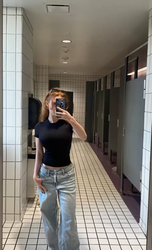 Skinny redhead in the bathroom