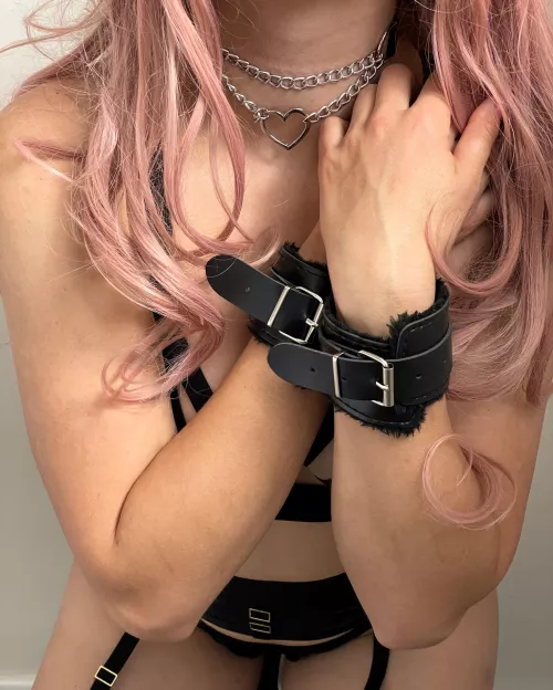 Cuffed and collared for your pleasure