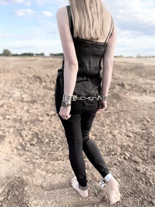 Shackled behind my back and made to walk across the wasteland barefoot