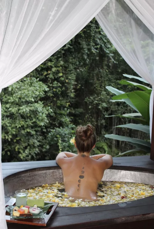 What’s the coolest place you’ve been nude? This is one of the top spots for me, a flower bath overlooking a river in Bali.