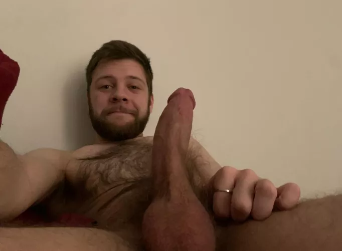 in bed with a hard dick and chesthair out. 🤤
