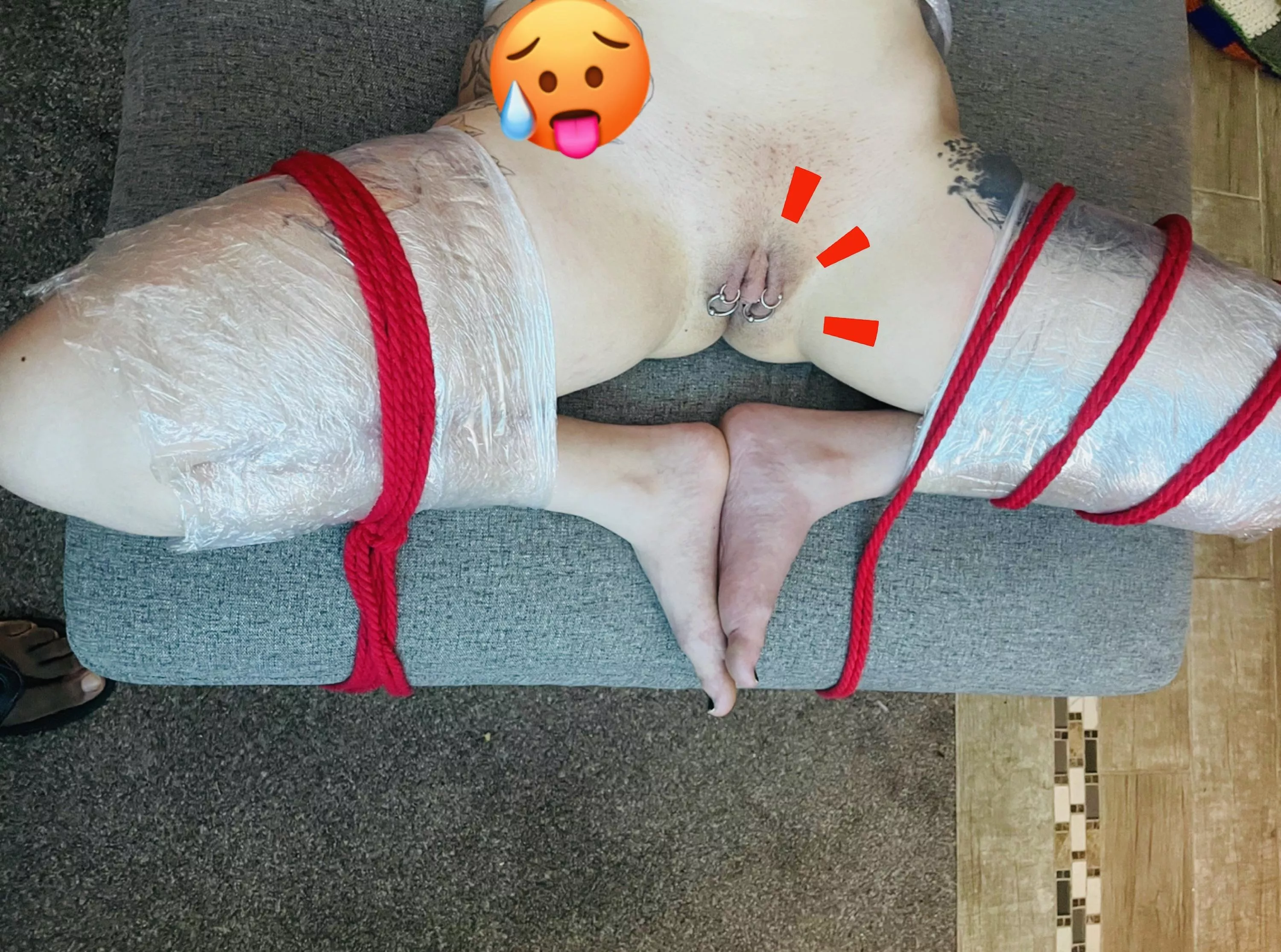 Plastic wrapped bondage with my legs open.