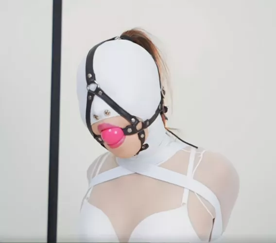 White leather hood with a harness gag