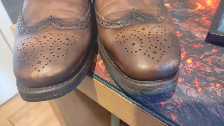 Attempt to remove scuff marks with Saphir ended in stains - how do I sort this?