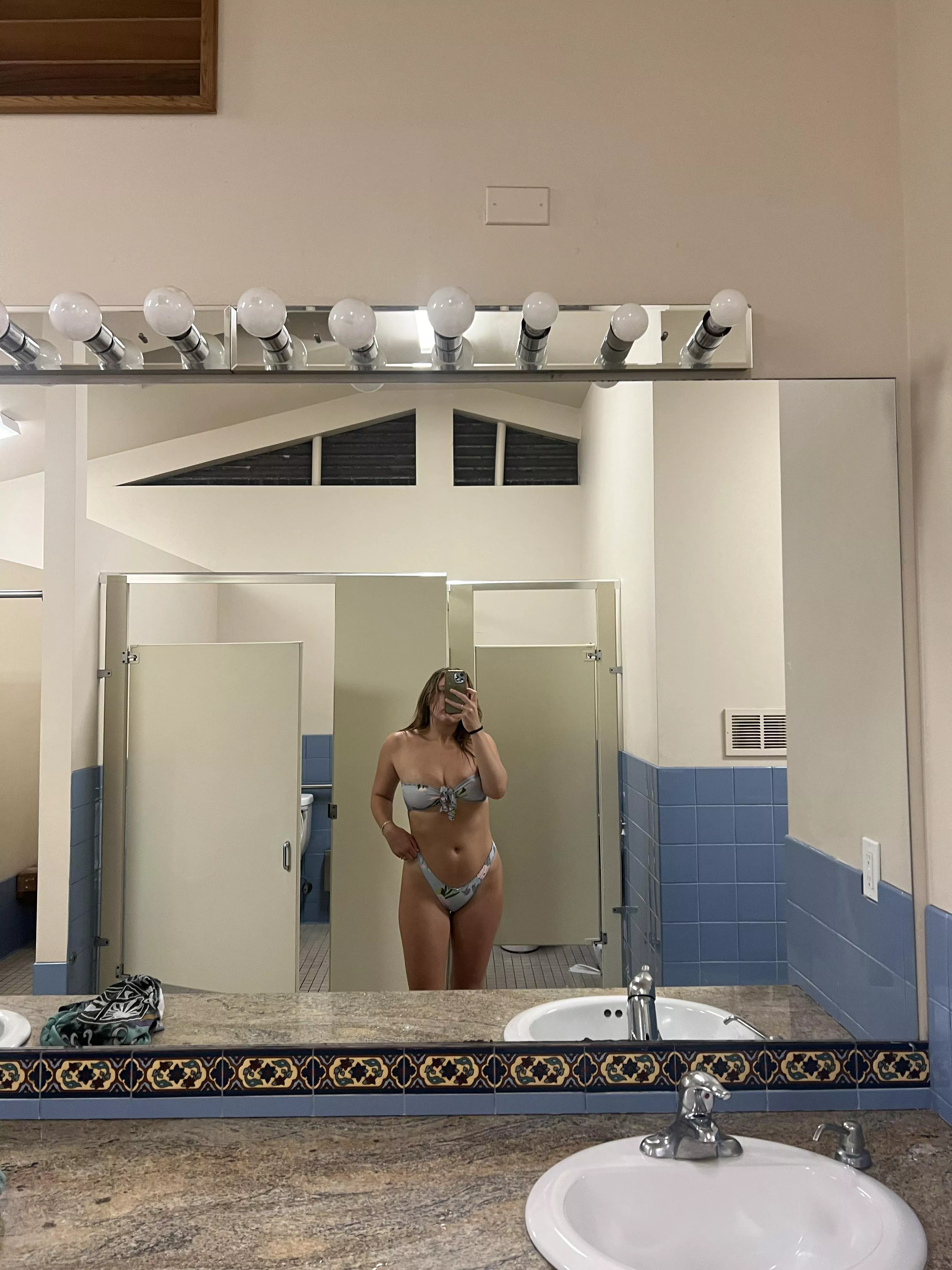 Just a petite girl infront of a mirror