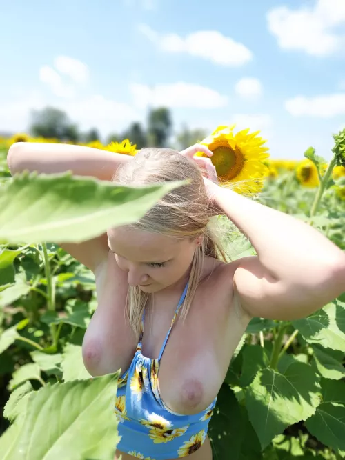 Pulling my hair back for a little fun in the sunflowers