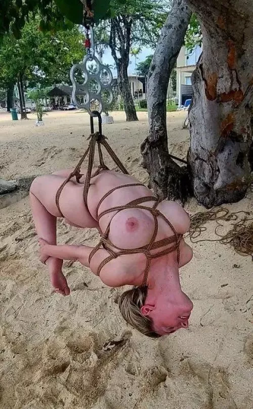 Suspension shibari on the beach