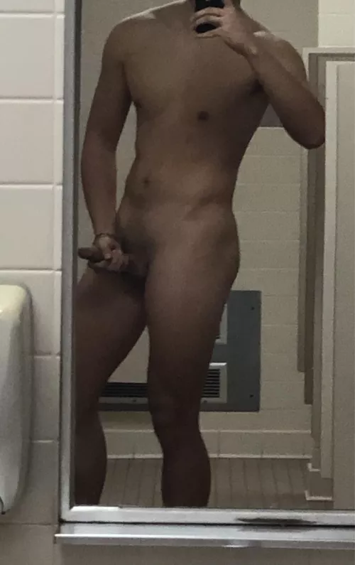 Jerking off completely naked in a very public restroom