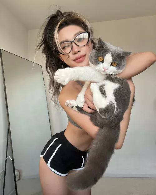 Playing with her cat