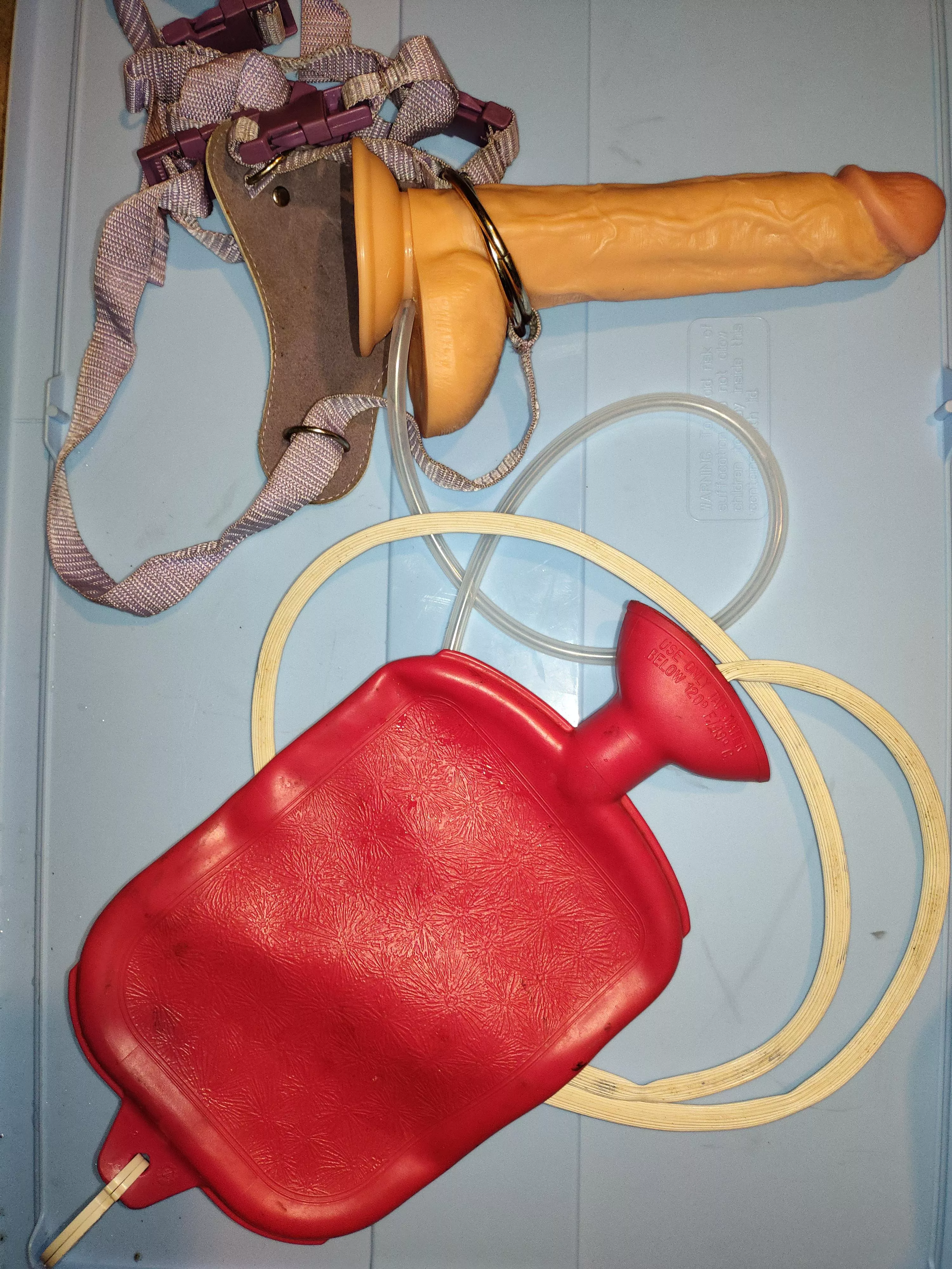 What you think of it? Have you done something similar? It is a dildo which I drilled a hole on a strap on used as a nozzle to fill and give anal