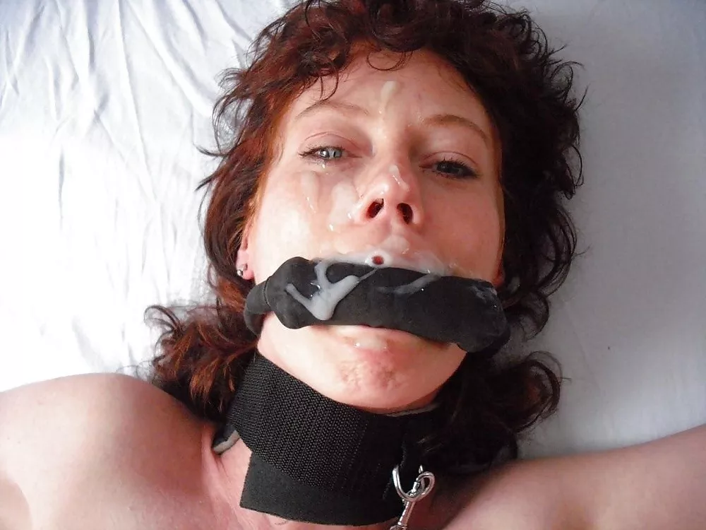 Collared, gagged, and covered in cum