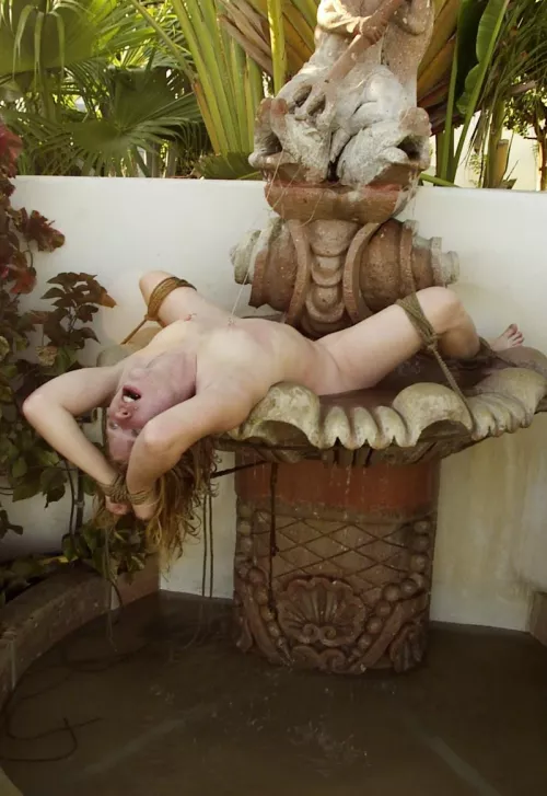 Madison Young as part of the water feature